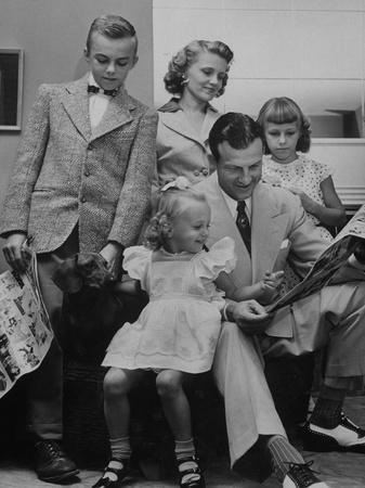 St. Louis Cardinals Player Stan Musial Reading the Newspaper with His Wife  and Children' Photographic Print