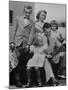 St. Louis Cardinals Player Stan Musial Reading the Newspaper with His Wife and Children-null-Mounted Photographic Print