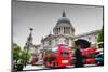 St Paul's Cathedral in London, the Uk. Red Buses in Motion and Man Walking with Umbrella.-Michal Bednarek-Mounted Photographic Print