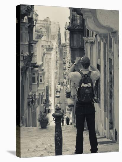 St. Ursula Street and Visitor, Triq Sant-Orsla, Valletta, Malta-Walter Bibikow-Stretched Canvas