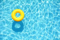 Yellow Pool Float, Ring Floating in a Refreshing Blue Swimming Pool-StacieStauffSmith Photos-Photographic Print