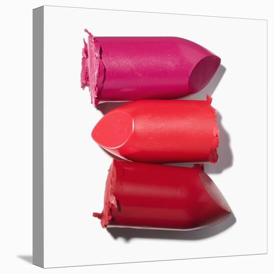 Stack of broken lipstick-Jack Miskell-Stretched Canvas