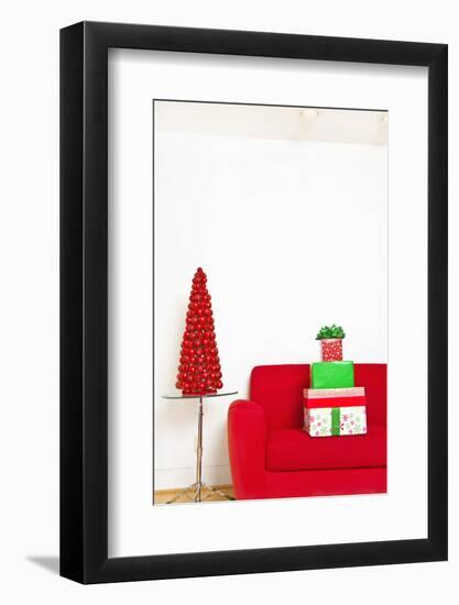 Stack of Christmas Gifts on Sofa-null-Framed Photographic Print