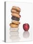 Stack of Donuts and One Apple-null-Stretched Canvas