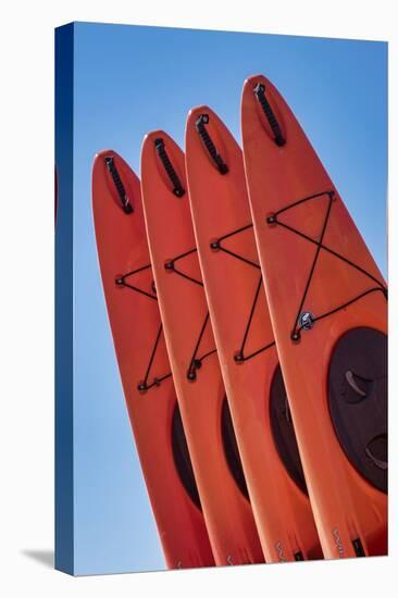 Stacked red kayaks on a beach, Florida, USA-Jim Engelbrecht-Stretched Canvas