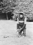 A Chimpanzee playing a round of golf-Staff-Framed Photographic Print