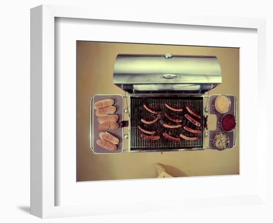 Stainless Steel Barbecue Grill, Upon Which are Buns, Hot Dogs, and Condiments, 1960-Eliot Elisofon-Framed Photographic Print