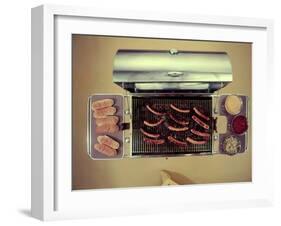 Stainless Steel Barbecue Grill, Upon Which are Buns, Hot Dogs, and Condiments, 1960-Eliot Elisofon-Framed Photographic Print