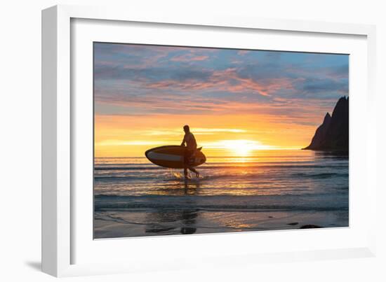 Stand up paddle boarder man admiring midnight sun walking back to the beach-Roberto Moiola-Framed Photographic Print