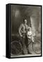 Standing Bicyclist with Little Girl on Handlebars-null-Framed Stretched Canvas
