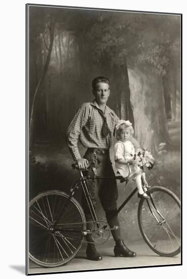 Standing Bicyclist with Little Girl on Handlebars-null-Mounted Art Print