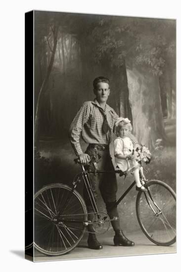 Standing Bicyclist with Little Girl on Handlebars-null-Stretched Canvas