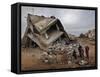 Standing in the Rubble of their Destroyed House, Palestinians Look Up at an Israeli Air Force Drone-null-Framed Stretched Canvas