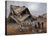 Standing in the Rubble of their Destroyed House, Palestinians Look Up at an Israeli Air Force Drone-null-Stretched Canvas