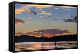 Standup Paddleboarder Silhouetted by Sunset, Whitefish Lake, Montana-Chuck Haney-Framed Stretched Canvas