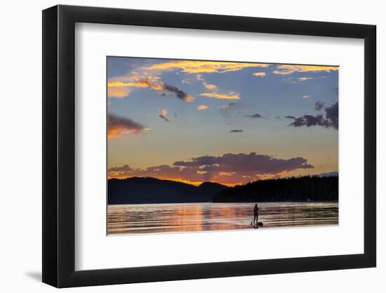 Standup Paddleboarder Silhouetted by Sunset, Whitefish Lake, Montana-Chuck Haney-Framed Photographic Print