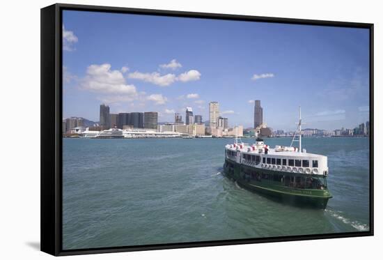 Star Ferry sailing towards the Kowloon side of Victoria Harbour, Hong Kong, China, Asia-Fraser Hall-Framed Stretched Canvas