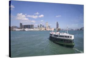 Star Ferry sailing towards the Kowloon side of Victoria Harbour, Hong Kong, China, Asia-Fraser Hall-Stretched Canvas