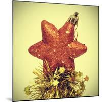 Star-Shaped Christmas Ornament and Golden Tinsel with a Retro Effect-nito-Mounted Photographic Print