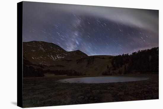 Star Trails and the Blurred Band of the Milky Way Above a Lake in the Eastern Sierra Nevada-null-Stretched Canvas