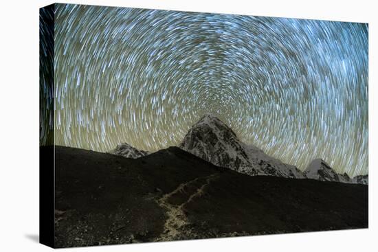 Star trails over Pumori Peak in the Himalayas, Nepal hiking to Everest Base Camp from Gorak Shep-David Chang-Stretched Canvas