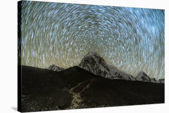 Star trails over Pumori Peak in the Himalayas, Nepal hiking to Everest Base Camp from Gorak Shep-David Chang-Stretched Canvas