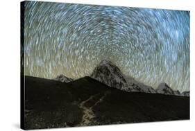 Star trails over Pumori Peak in the Himalayas, Nepal hiking to Everest Base Camp from Gorak Shep-David Chang-Stretched Canvas