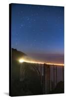 Stars over Big Sur's Bixby Creek Bridge near Monterey, California at night along the coast-David Chang-Stretched Canvas