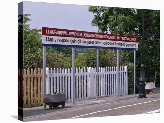 Station Sign at Llanfairpwllgwyngyllgo-Gerychwyrndrobwllllantysiliogogogoch-Nigel Blythe-Stretched Canvas