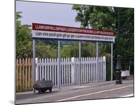 Station Sign at Llanfairpwllgwyngyllgo-Gerychwyrndrobwllllantysiliogogogoch-Nigel Blythe-Mounted Photographic Print