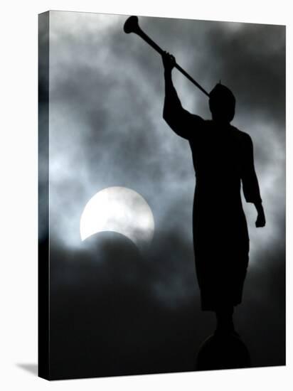 Statue is Seen Against a Cloudy Sky and a Partial Solar Eclipse in Bogota, Colombia-null-Stretched Canvas