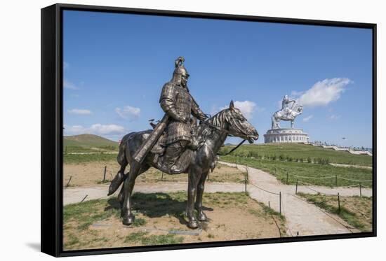 Statue of a Mongolian Empire warrior and Genghis Khan Statue Complex in the background, Erdene, Tov-Francesco Vaninetti-Framed Stretched Canvas