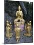 Statue of Buddha with Kneeling Faithful-null-Mounted Giclee Print