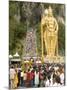 Statue of Hindu Deity with Pilgrims Walking 272 Steps up to Batu Caves, Selangor, Malaysia-Richard Nebesky-Mounted Premium Photographic Print