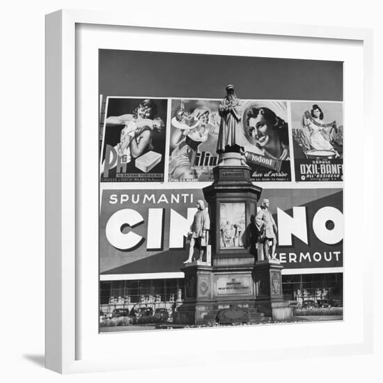 Statue of Leonardo Da Vinci on Top of Monument in Front of Giant Advertising Billboard-Alfred Eisenstaedt-Framed Photographic Print