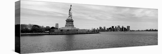 Statue of Liberty with Manhattan Skyline in the Background, Ellis Island, New Jersey-null-Stretched Canvas