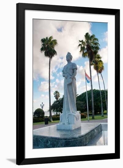 Statue of Queen Wilhelmina in Oranjestad, Aruba with the Dutch Flag Standing in a Square Surrounded-PlusONE-Framed Photographic Print