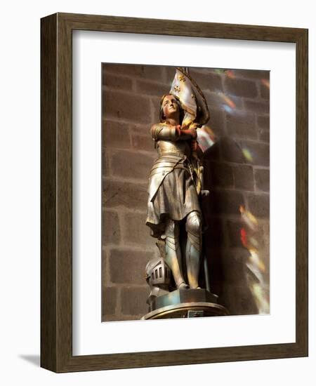 Statue of St. Joan of Arc with Coloured Light from Stained Glass, Church of Notre Dame, Vitre, Brit-Nick Servian-Framed Photographic Print