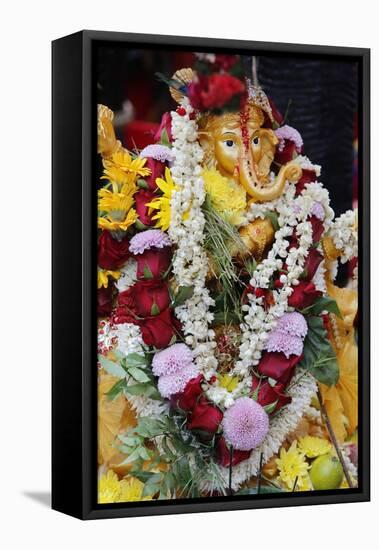 Statue of the Hindu God Ganesh with Garlands, Paris, France, Europe-Godong-Framed Stretched Canvas