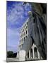 Statue with the Palazzo Della Civilta Di Lavoro Behind, Eur, Lazio, Italy-Oliviero Olivieri-Mounted Photographic Print