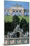 Statues on a Fountain with Archs in the Background in a Garden-null-Mounted Photographic Print