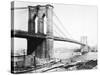 Steam Ship Passing Underneath Brooklyn Bridge-null-Stretched Canvas