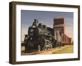 Steam Train and Grain Elevator in Western Development Museum, Saskatchewan, Canada-Walter Bibikow-Framed Premium Photographic Print