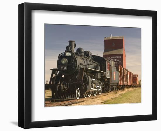 Steam Train and Grain Elevator in Western Development Museum, Saskatchewan, Canada-Walter Bibikow-Framed Photographic Print