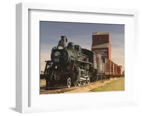 Steam Train and Grain Elevator in Western Development Museum, Saskatchewan, Canada-Walter Bibikow-Framed Photographic Print