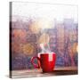 Steaming Cup of Coffee over a Cityscape Background-George D.-Stretched Canvas