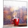 Steaming Cup of Coffee over a Cityscape Background-George D.-Mounted Photographic Print