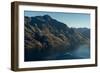 Steamship powers across a dark lake with sharp large mountains, Queenstown, Otago, New Zealand-Logan Brown-Framed Photographic Print