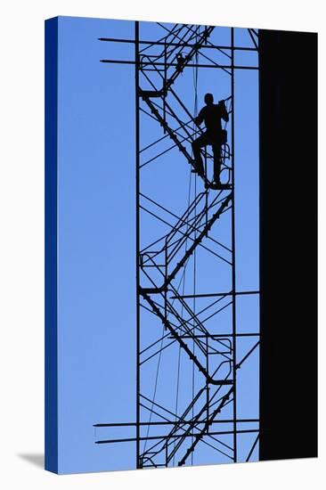 Steelworker Assembling Scaffolding-null-Stretched Canvas