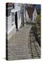 Steep Cobbled Street and White Wooden Houses-Eleanor Scriven-Stretched Canvas